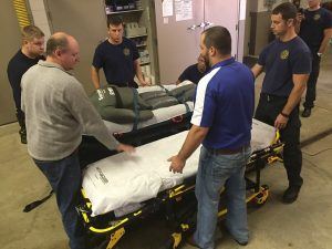 Six Men Transporting a Dummy